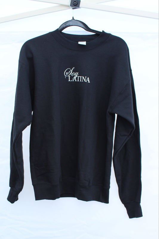 Black sweatshirt with Soy Latina text logo in white.